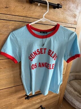 Zara Light Blue Tee with Red Trim and Graphic